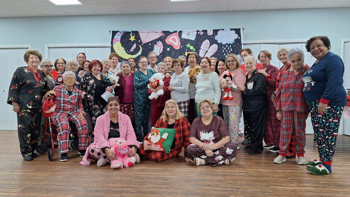 Seniors participate in a pajama-themed activity at Goodlet Park during a program hosted by the Little Havana Activities & Nutrition Centers in Hialeah.